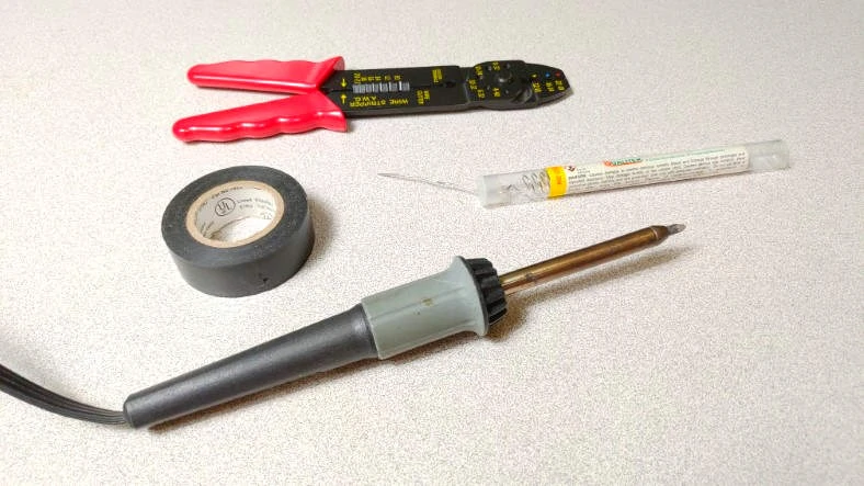 Example of soldering iron and accessories needed to solder wire
